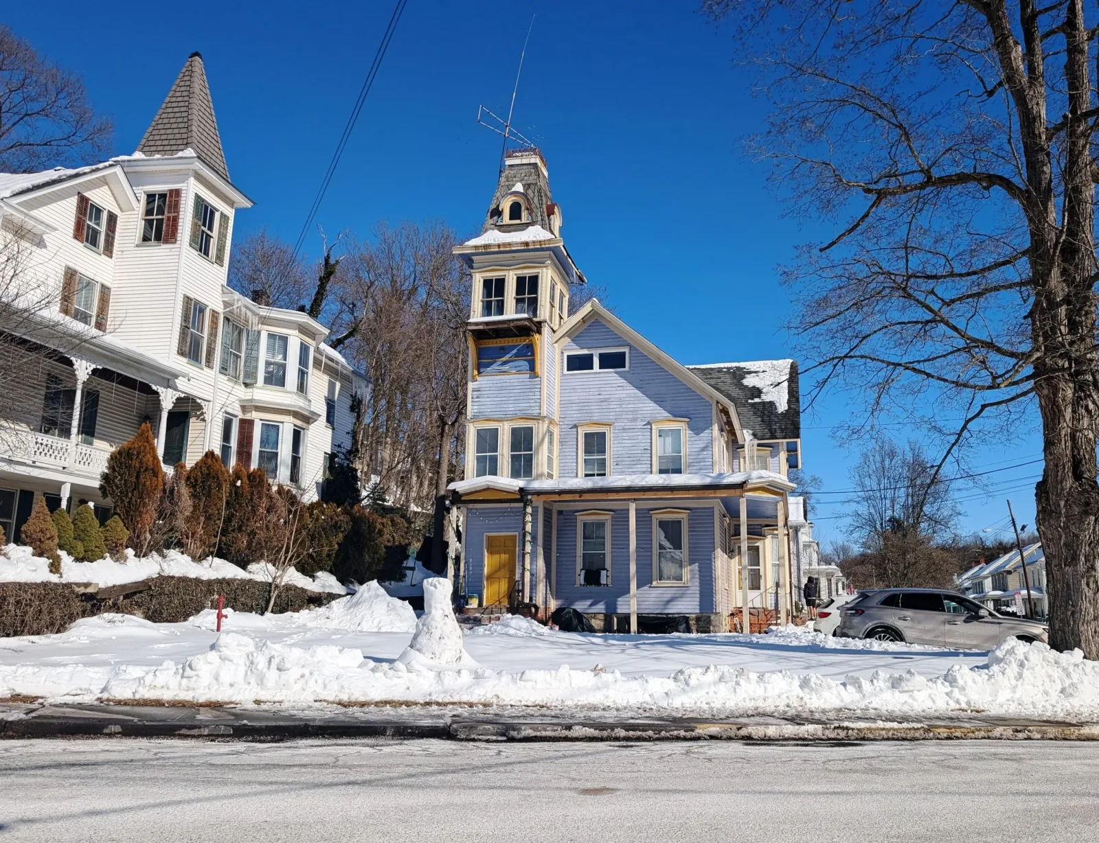 Snow-covered houses at the junction of Bridge Street and Main Street in Blairstown, New Jersey.