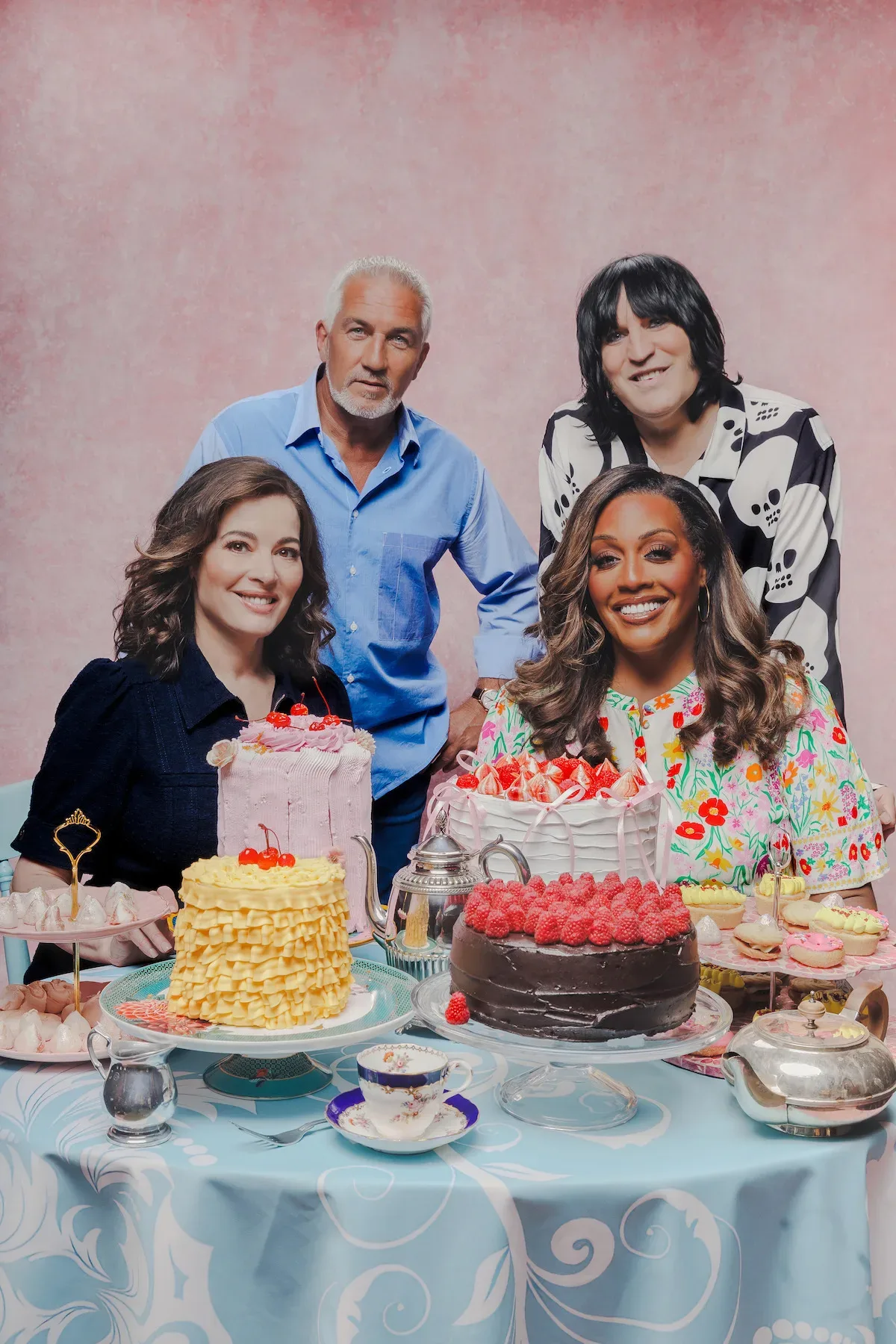 Paul Hollywood, Alison Hammond, Nigella Lawson and Noel Fielding behind a table of cakes