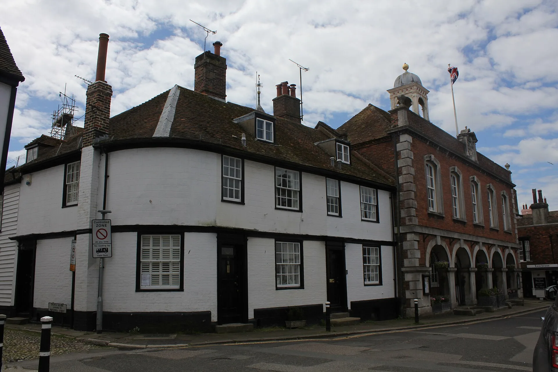 White cottages and the red-brick Town Hall along Market Street in Rye.